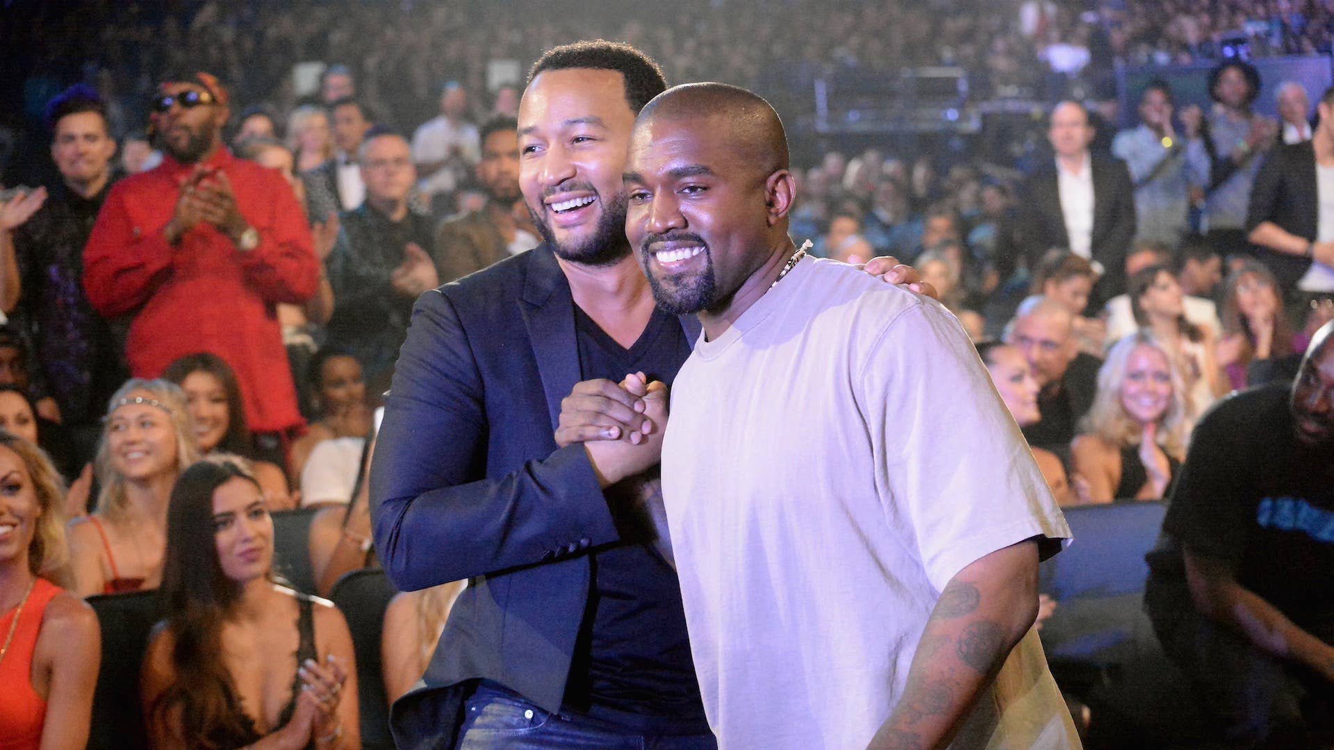 Recording artists John Legend (L) and Kanye West attend the 2015 MTV Video Music Awards