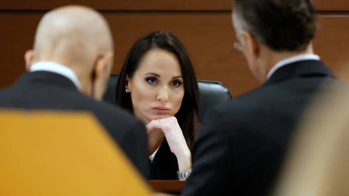 A judge is seen during a tense courtroom moment