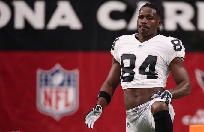 Antonio Brown stretches prior to a preseason game against Arizona.