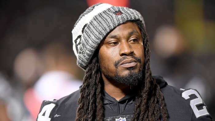 Marshawn Lynch looks on from the sidelines against the Detroit Lions.