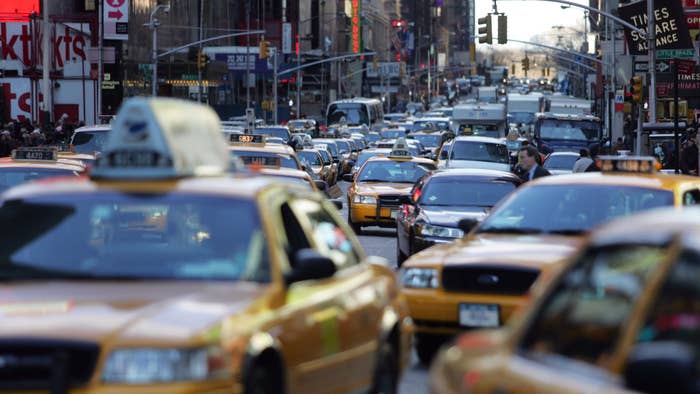 Traffic makes its way through Times Square.