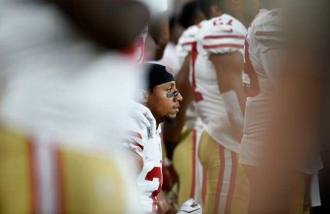 Eric Reid takes a knee during the national anthem before a preseason game.