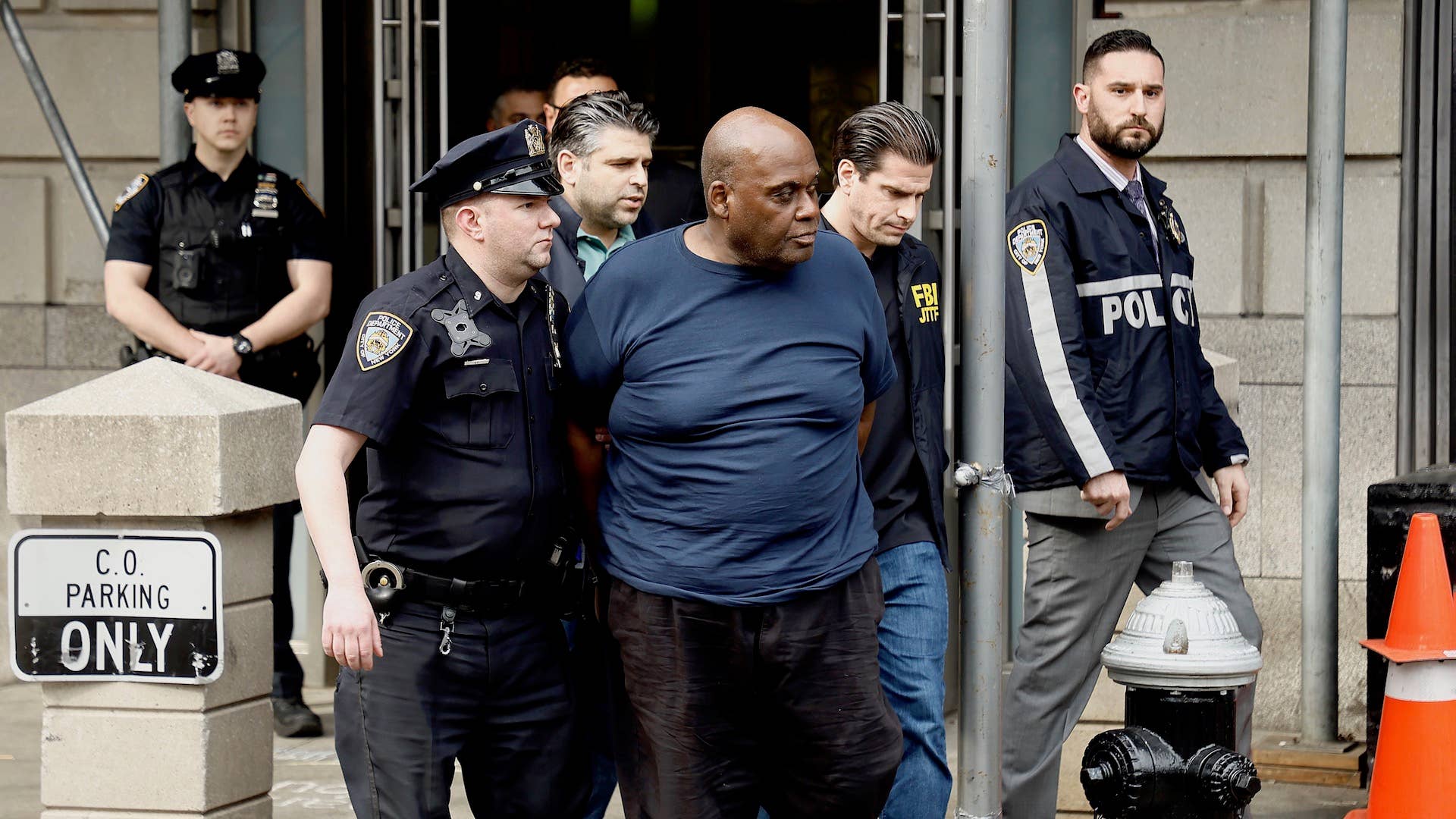 Suspected subway shooter, Frank James is escorted out by the FBI and NYPD officers