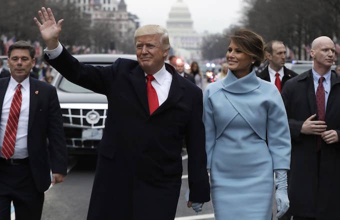 Donald and Melania Trump acknowledge the relatively small crowd at his inauguration.