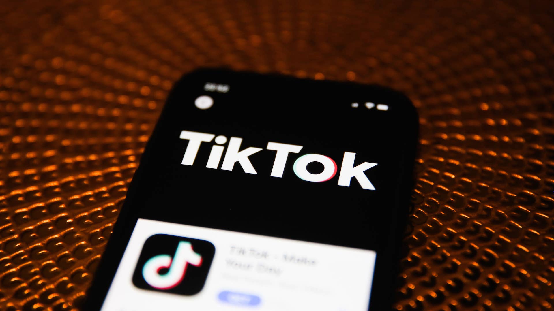 TikTok logo is seen displayed on phone screen