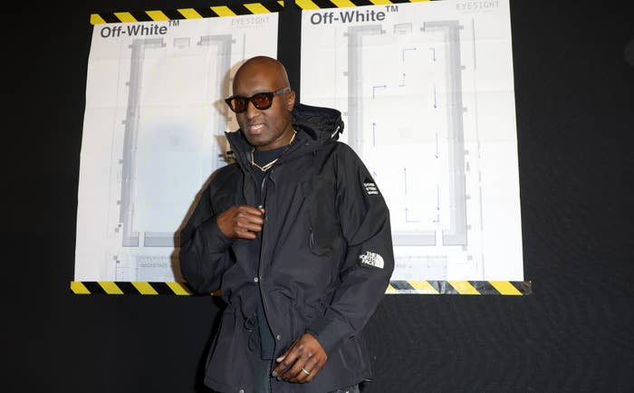 Virgil Abloh in front of Off-White logo