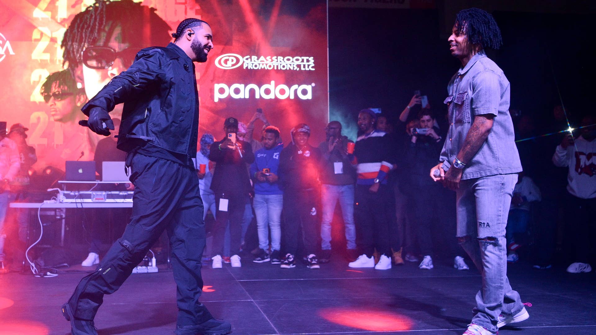 Drake and 21 Savage perform during Wicked Spelhouse Homecoming Concert.