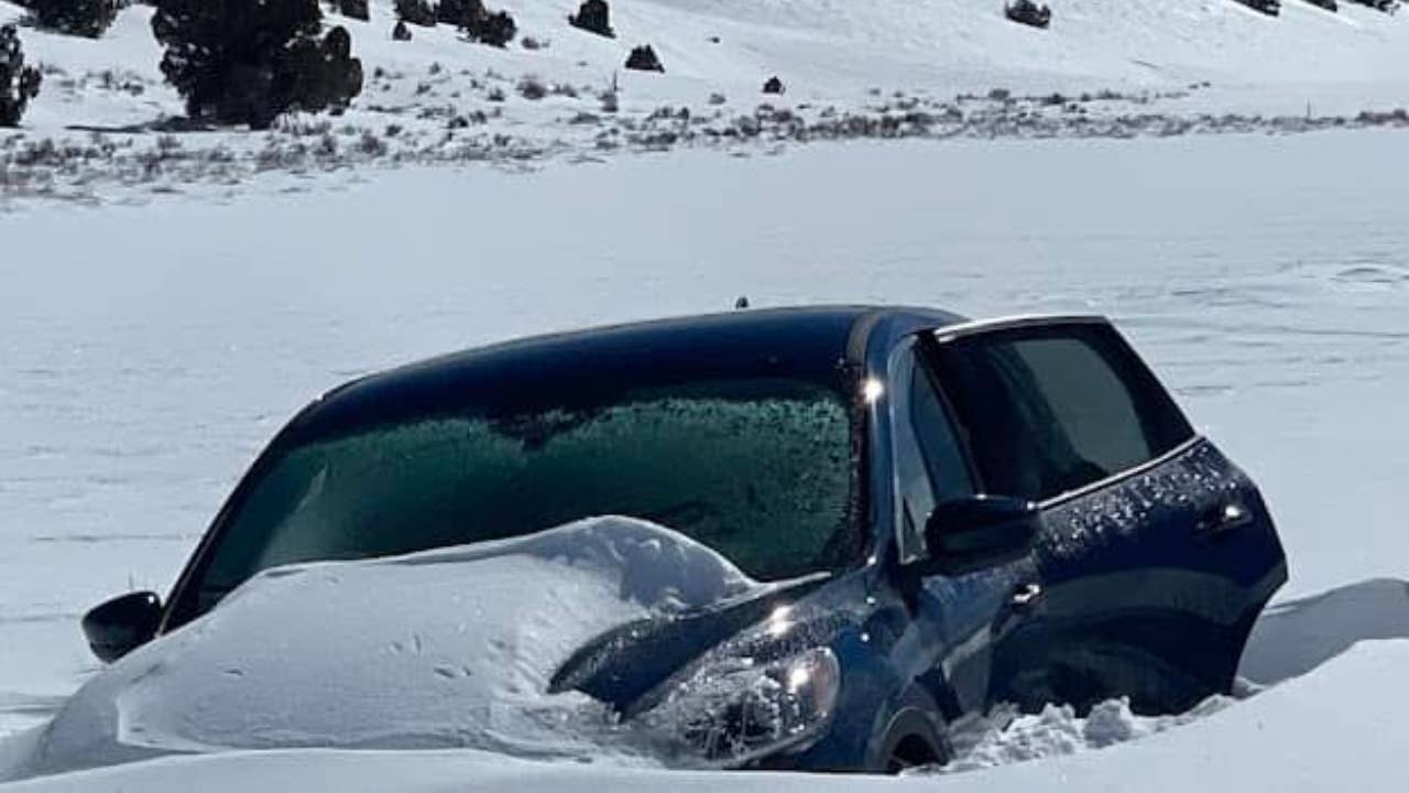 Snow is seen covering a car in California