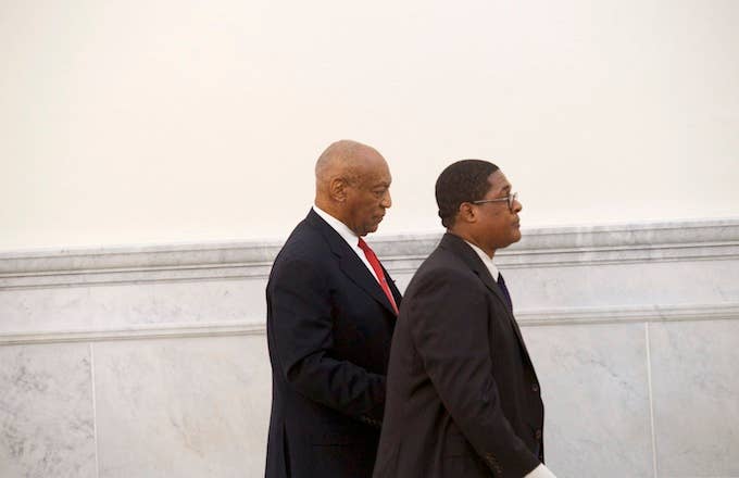 Bill Cosby walks with his publicist, Andrew Wyatt, after being found guilty.