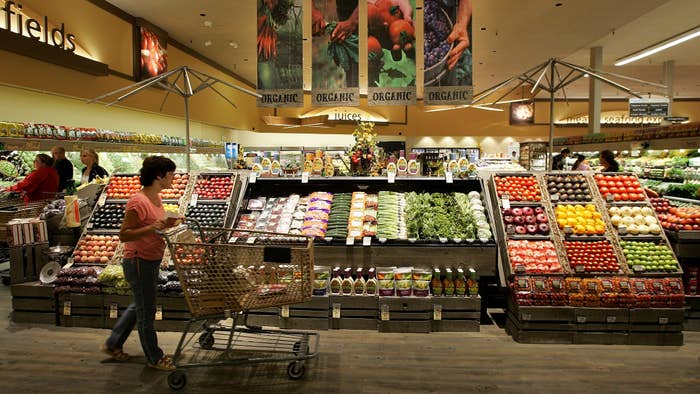 A Safeway customer browses in the fruit and vegetable section at Safeway.