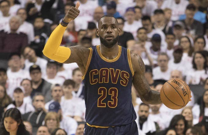 LeBron James brings up the ball during a playoff game against the Raptors.
