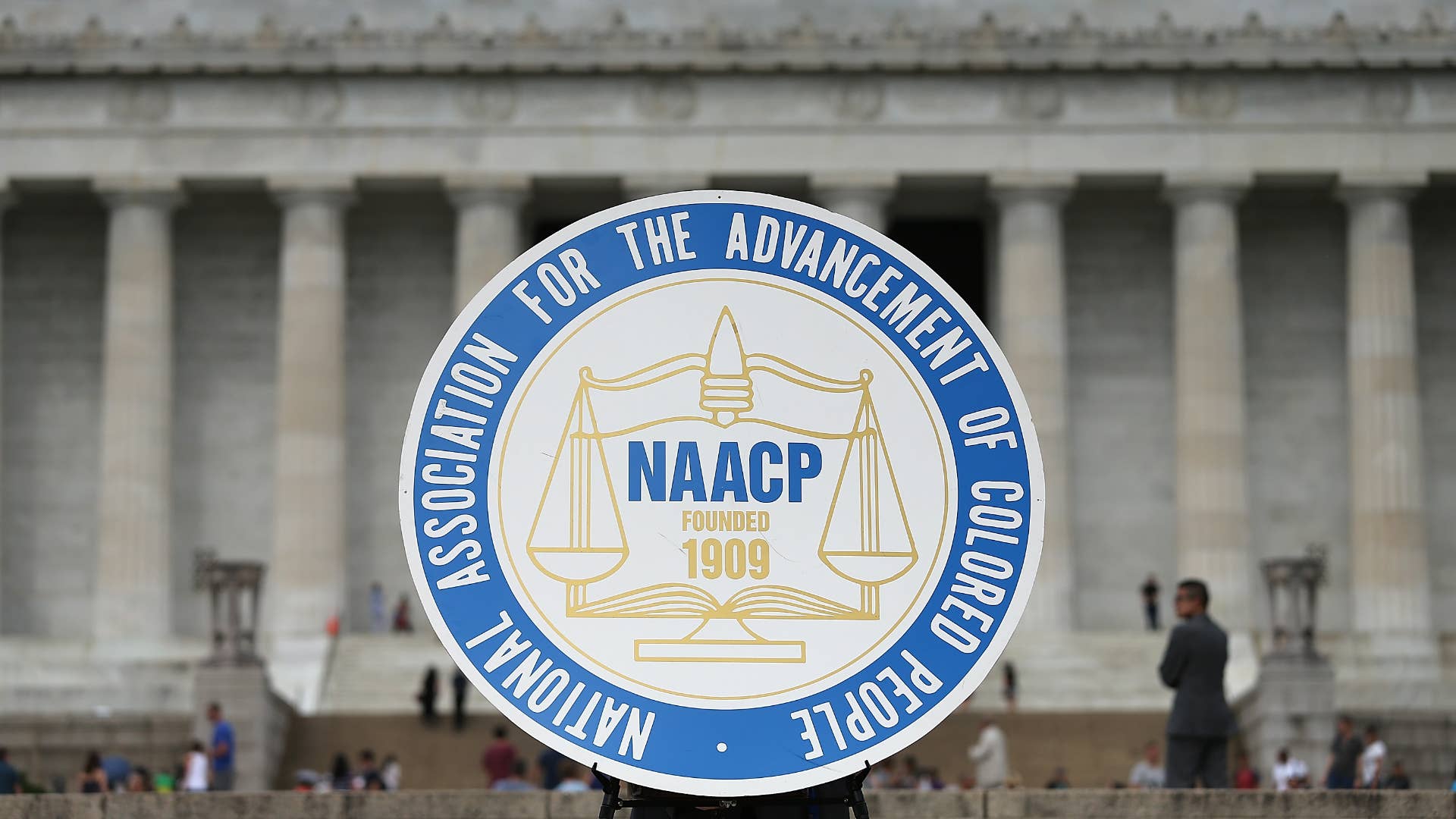 A logo is seen for the National Association for the Advancement of Colored People.