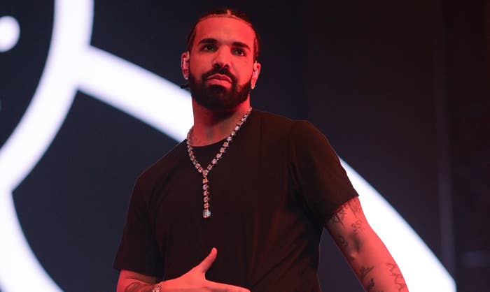 Drake onstage in a chain