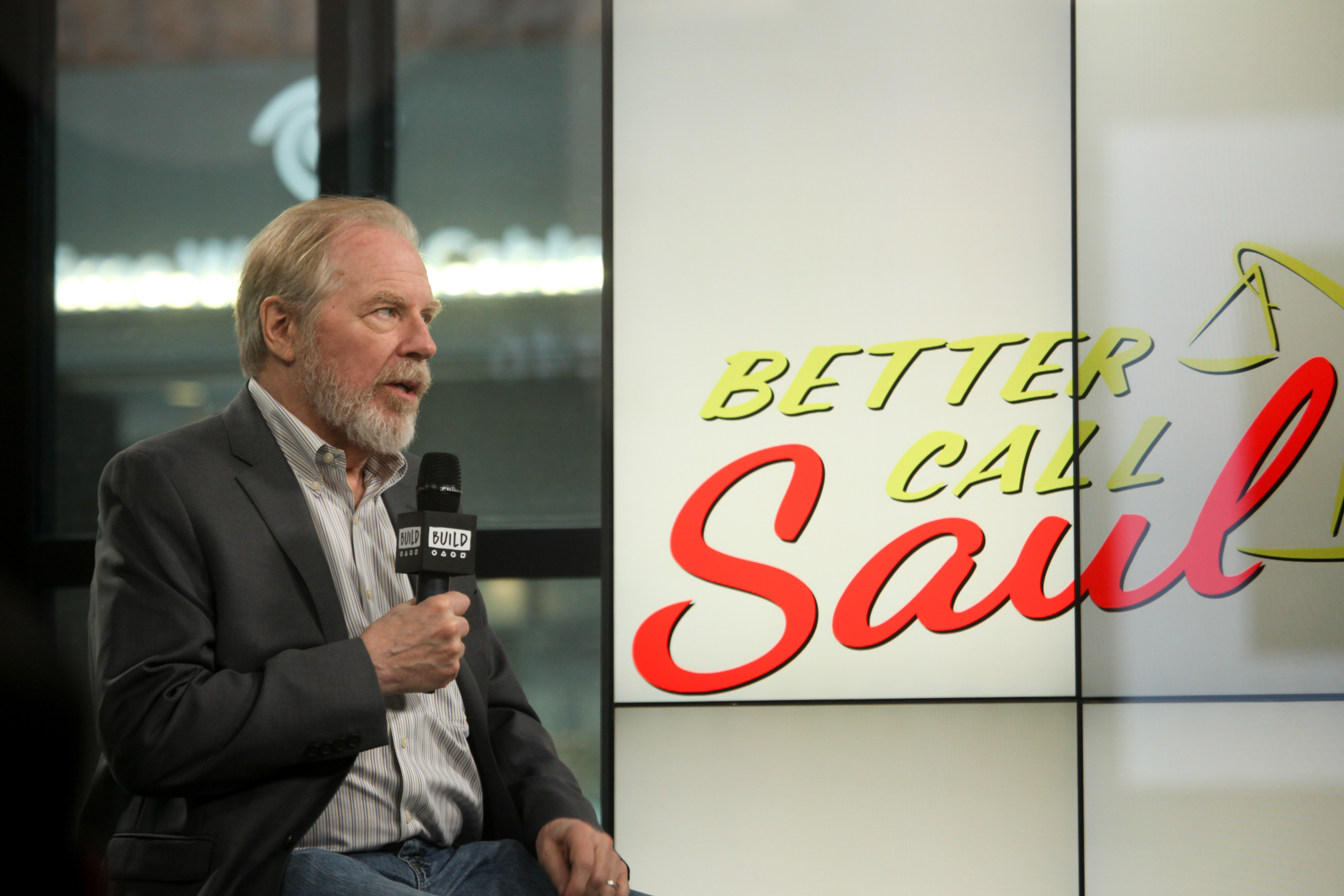 Michael McKean in front of the &#x27;Better Call Saul&quot; logo