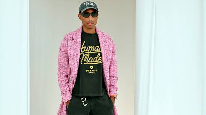 Pharrell is pictured wearing a Human Made shirt and a jacket