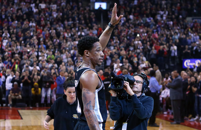 DeMar DeRozan waves to the Toronto crowd in his first game back.