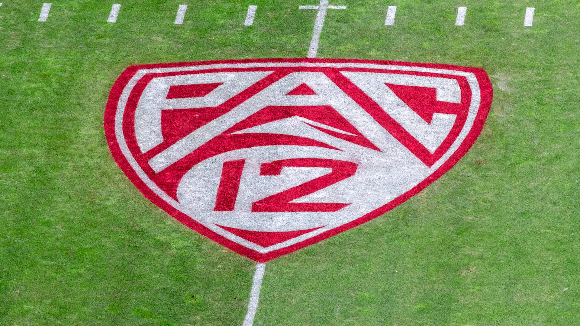 A detail view of the Pac 12 logo on the field at Stanford Stadium