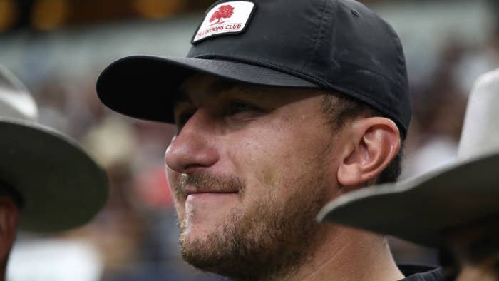 Johnny Manziel watches the Texas A&amp;M Aggies and the Arkansas Razorbacks