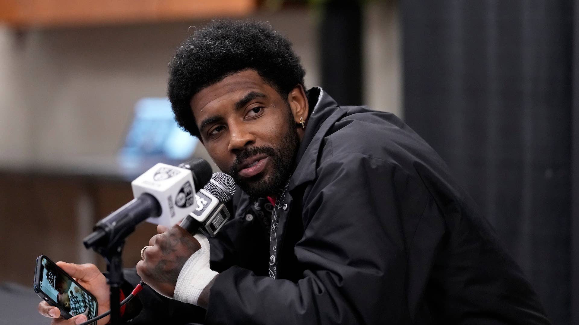 Kyrie Irving #11 of the Brooklyn Nets speaks with the media.