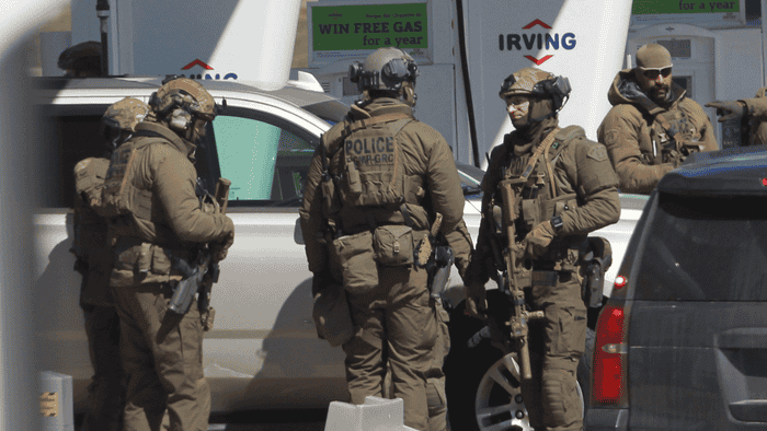 Members of the Royal Canadian Mountain Police tactical unit respond to a shooting.