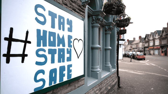 A sign implores UK residents to &#x27;stay home stay safe.&#x27;