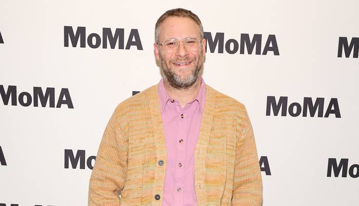 Seth Rogen smiling on a red carpet at MoMA
