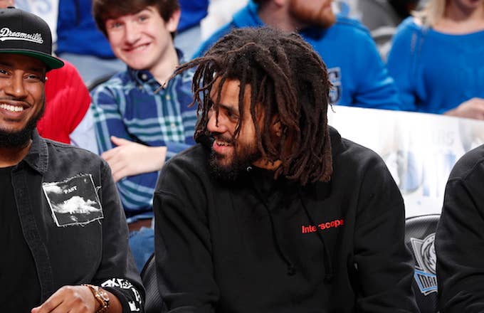 J. Cole watches the game between the Detroit Pistons and Dallas Mavericks.