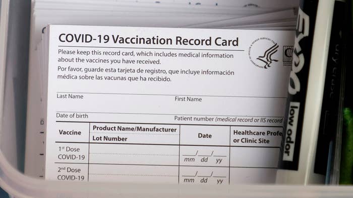 Covid 19 vaccination cards featuring CDC logo