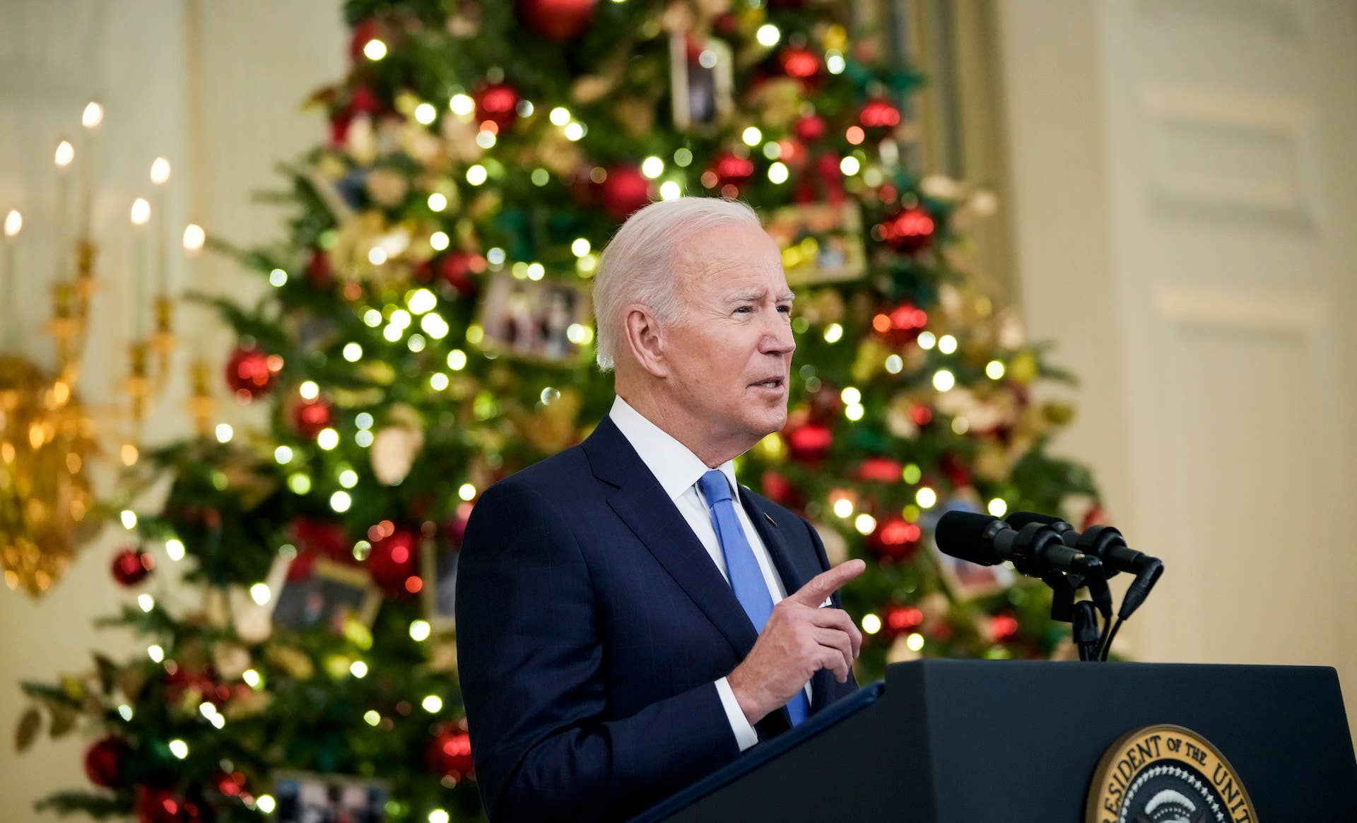 Joe Biden in front of a xmas tree