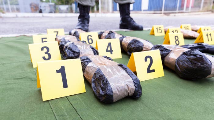 Photograph of police with cocaine packs