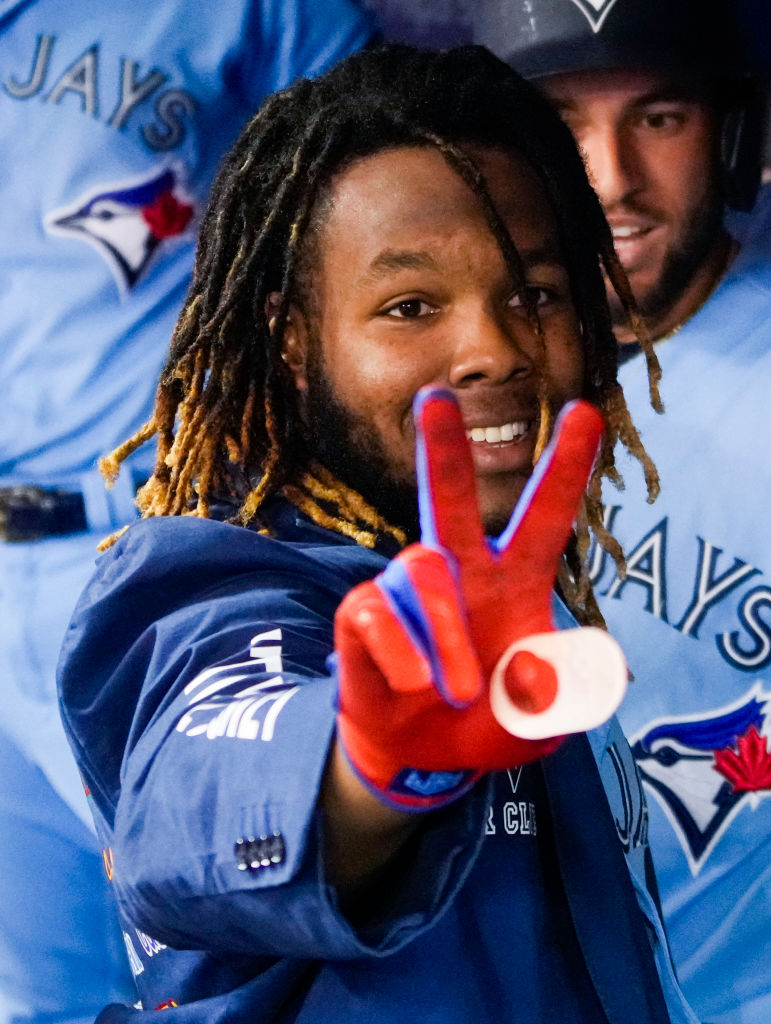 Vladimir Guerrero Jr. holding up a peace sign.