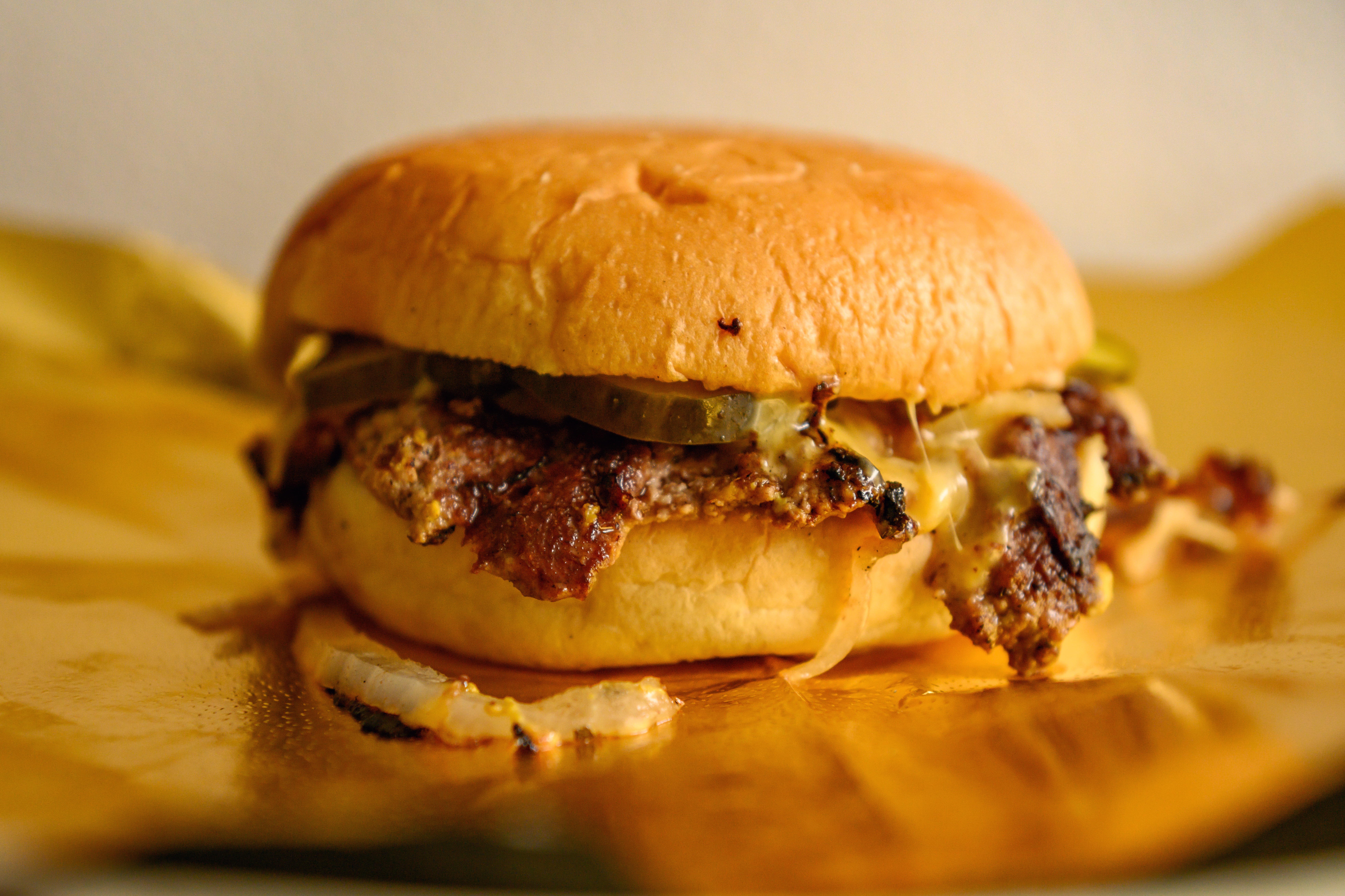 A close up of a Gold Standard burger