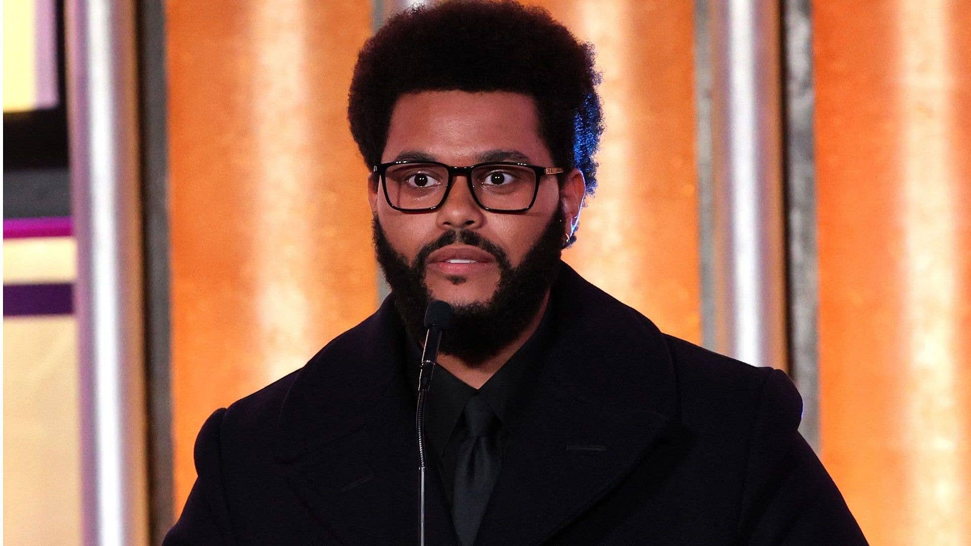 The Weeknd accepts The Quincy Jones Humanitarian Award onstage during the Music in Action Awards Ceremony