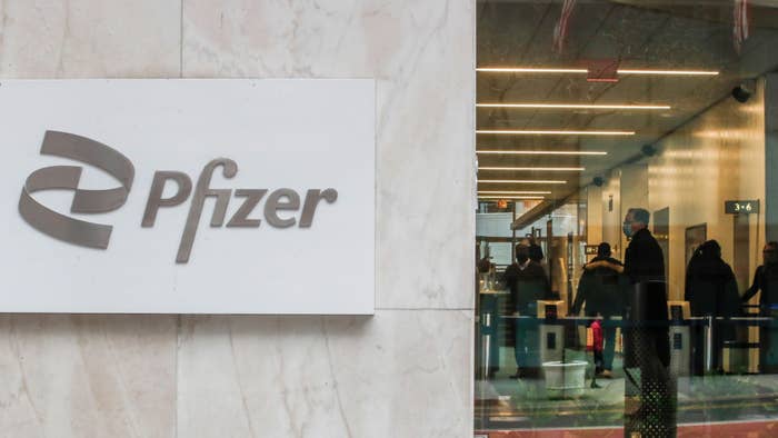 People are seen inside Pfizer headquarters on March 1, 2022