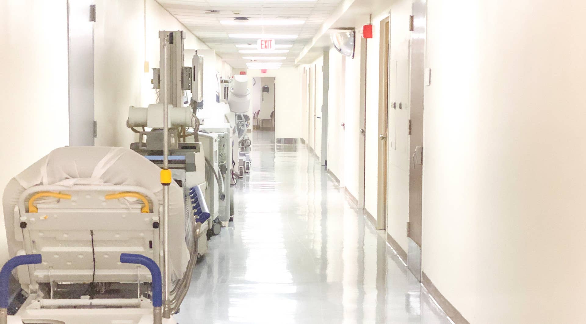 Hospital hallway corridor lined with medical equipment