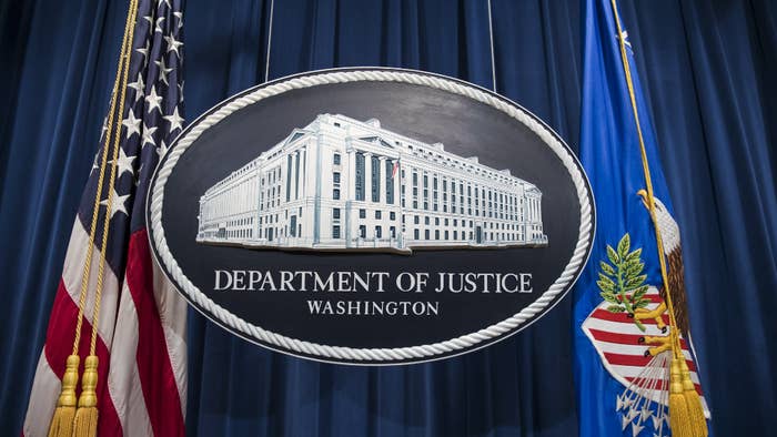 A logo for the Department of Justice is shown