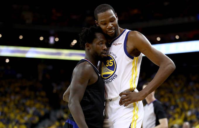 Patrick Beverley plays tight defense on Kevin Durant.
