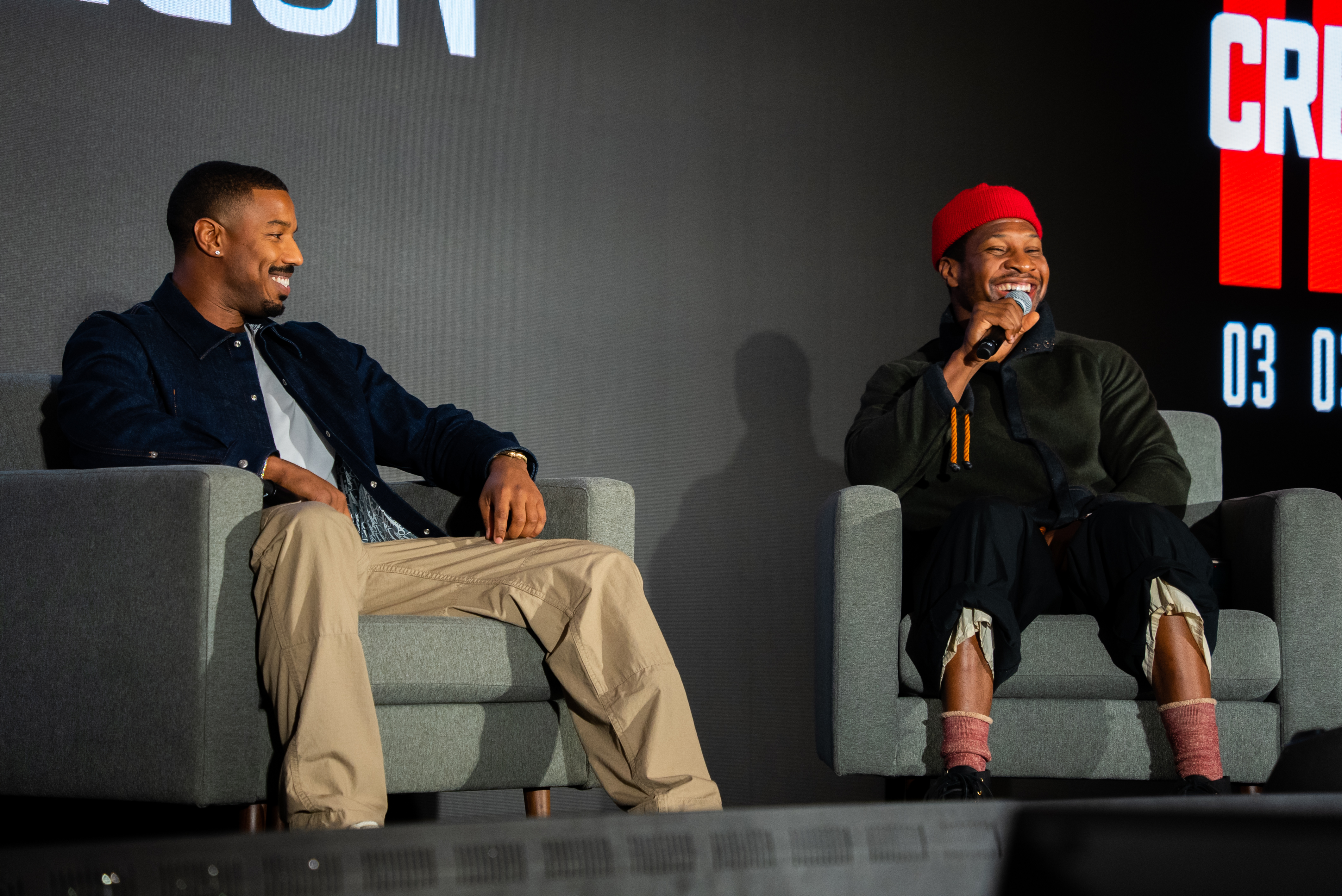 Jonathan Majors, left, and Michael B. Jordan arrive at the Vanity