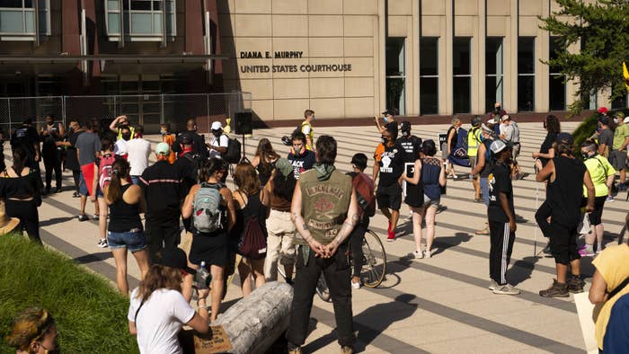 People gather during a protest outside Diana E. Murphy United States Courthouse in Minneapolis.