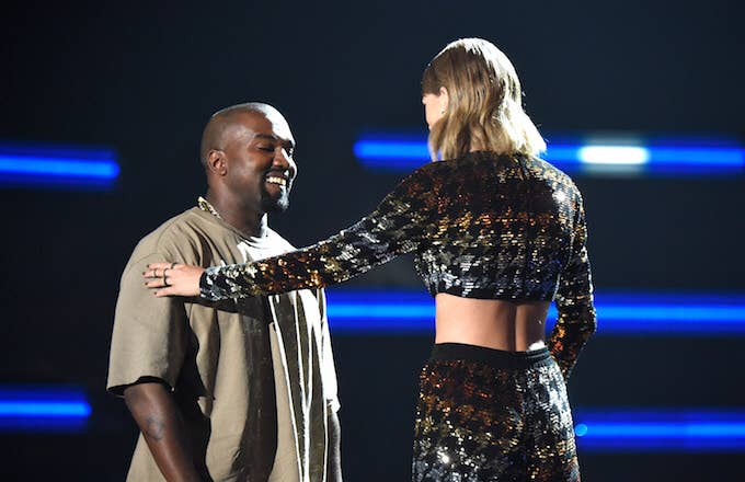 Kanye West and Taylor Swift greet one another.