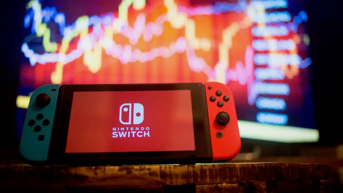 In this photo illustration, a Nintendo Switch displays the Nintendo Switch logo