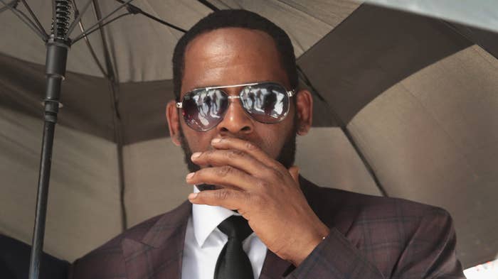 R&amp;B singer R. Kelly covers his mouth