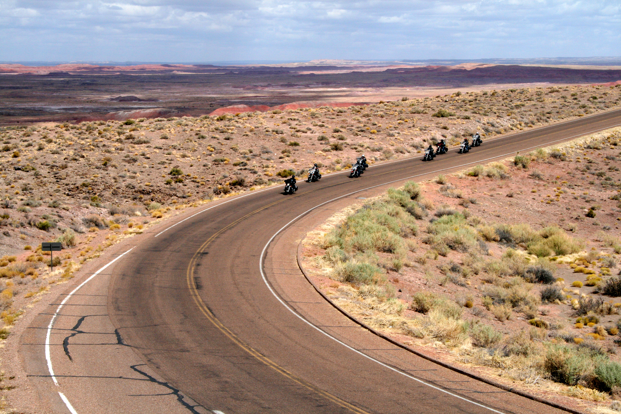 Bikers on a desert road