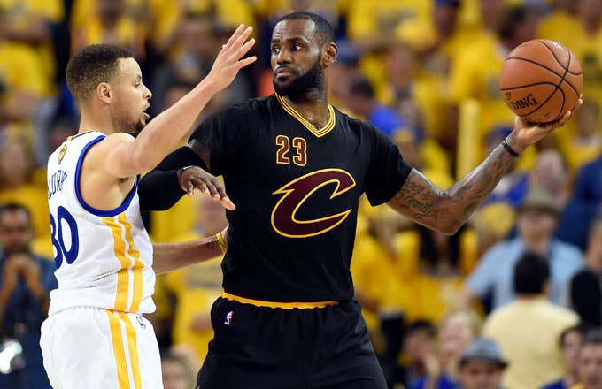 LeBron James holds the ball away from Stephen Curry during the 2016 NBA Finals.