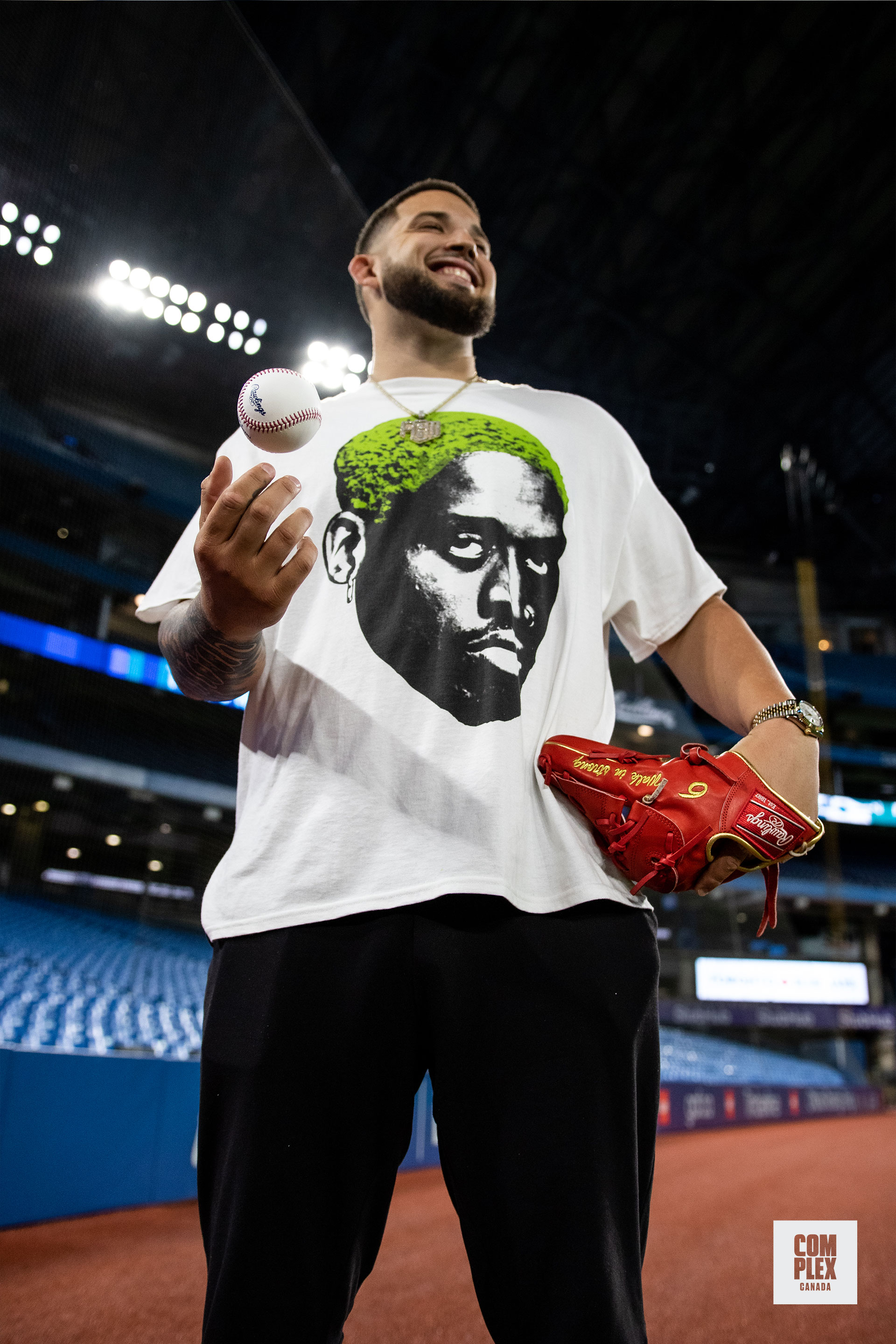 Toronto Blue Jays star Alek Manoah tosses a baseball while smiling