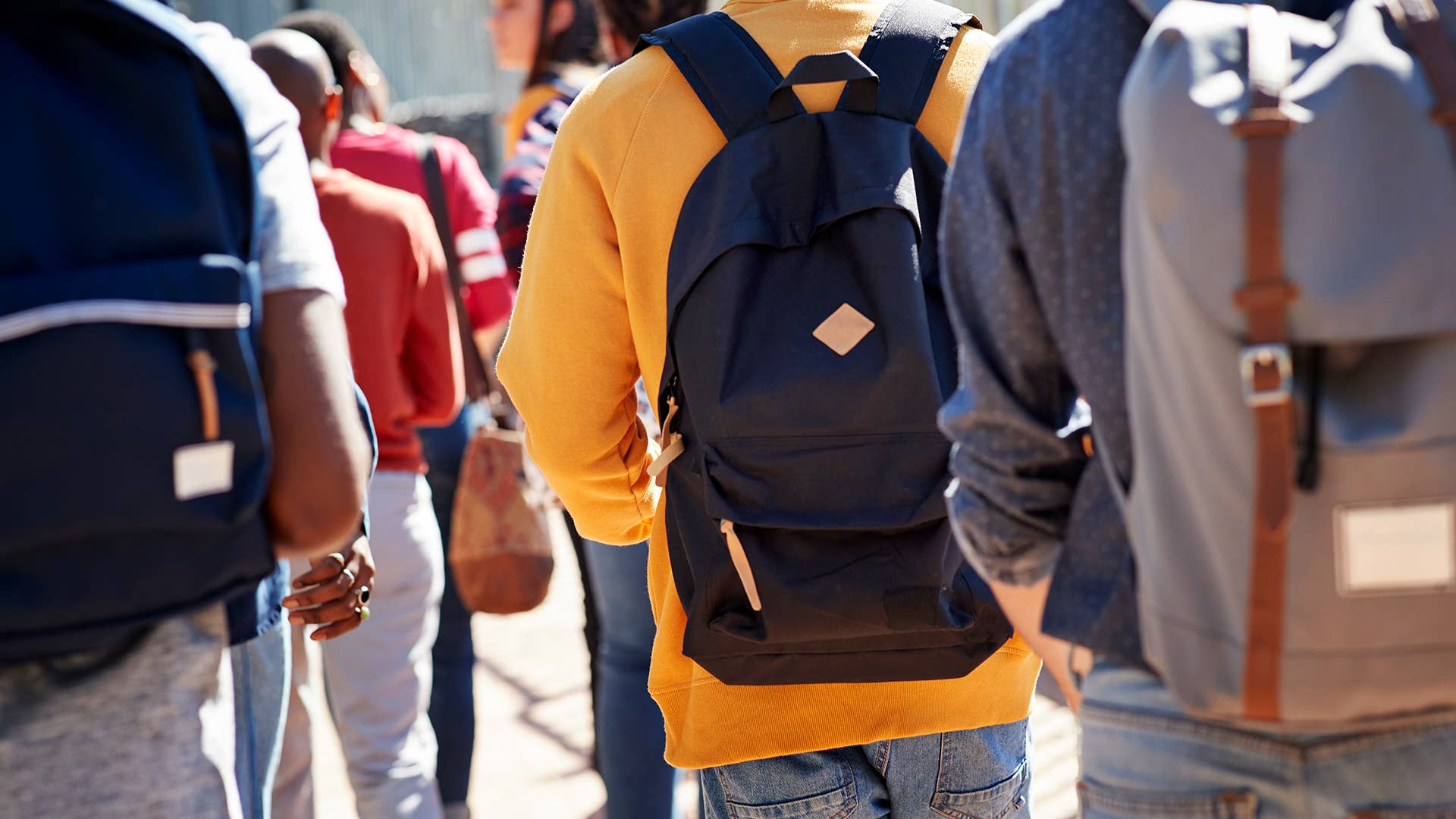 Male and female students walking at campus