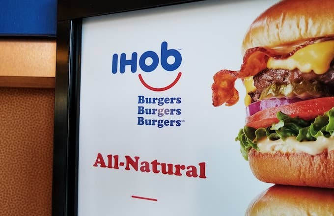 Close up of sign with IHoB (International House of Burgers) logo.