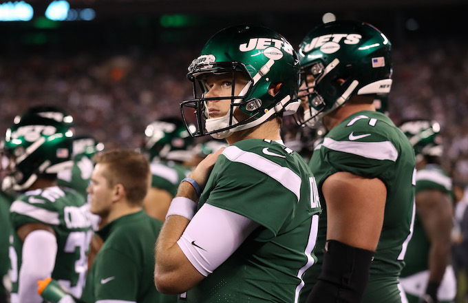 Sam Darnold looks on during loss against the New England Patriots.