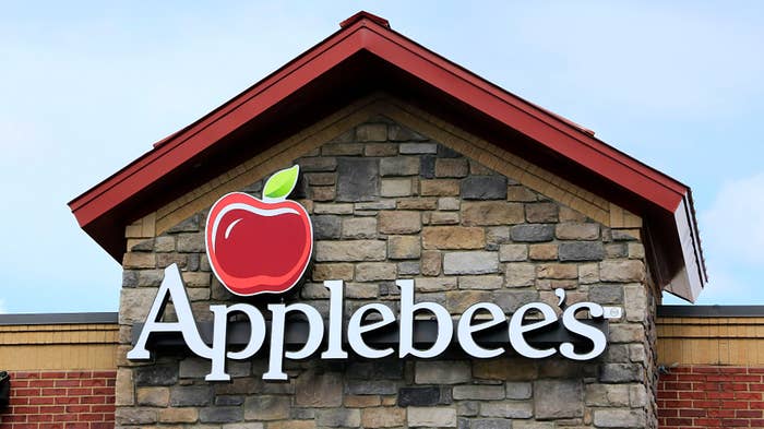 Applebee&#x27;s restaurant logo on wall above entrance.