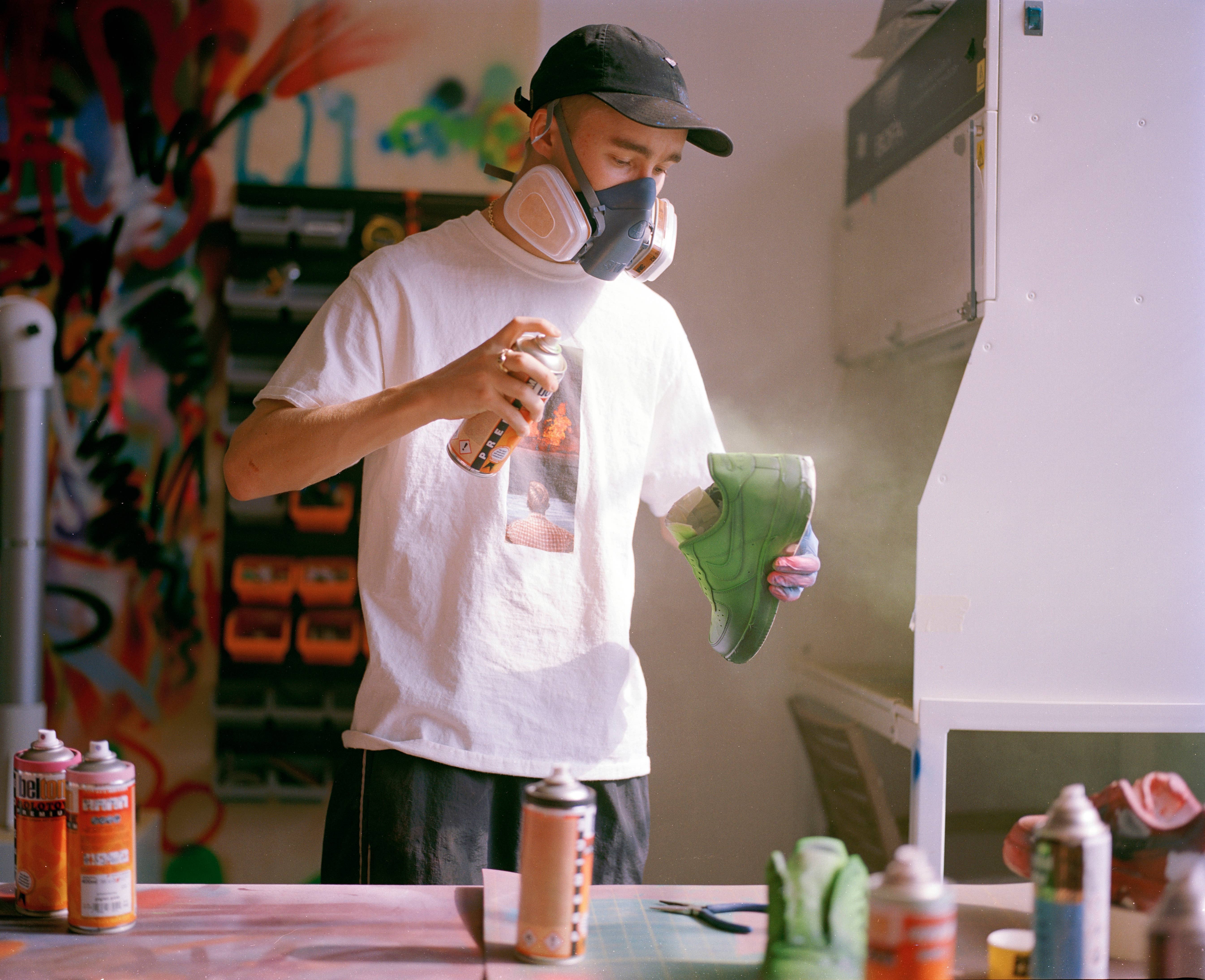 Cassius Hirst Painting a Pair of Nike Air Force 1's